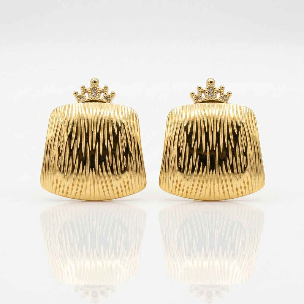 A pair of gold clutch-style earrings with a crown-shaped top and a vertically ribbed, textured body