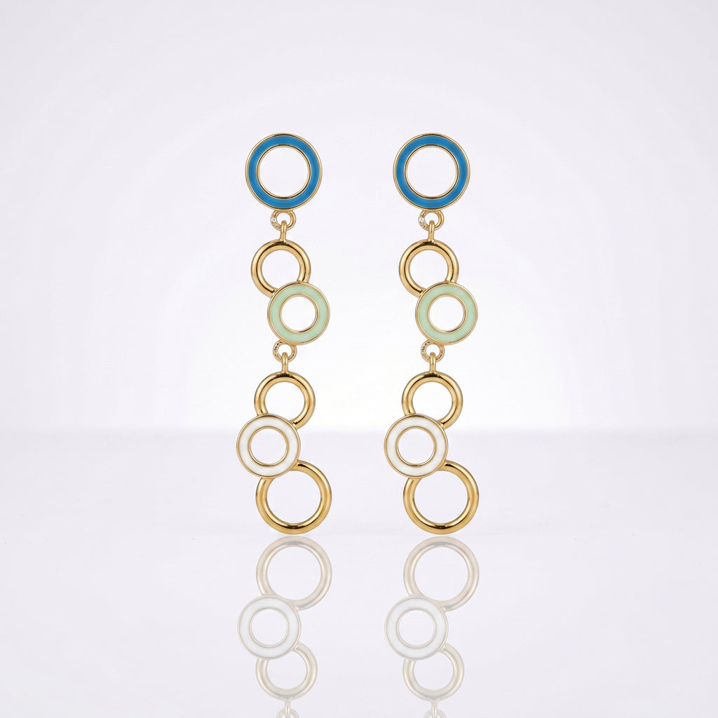 A pair of gold-tone dangle earrings with circular enamel details in blue, pale green, and white