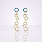 A pair of gold-tone dangle earrings with circular enamel details in blue, pale green, and white