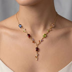 Necklace with multicolored gemstones on a neutral background