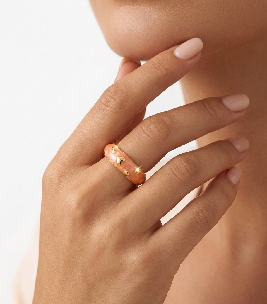 Pink enamel ring with gold heart accents