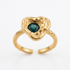 Gold ring with a green gemstone