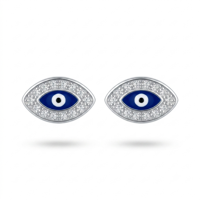 A pair of silver-toned evil eye stud earrings with blue enamel centers, white and black details, and clear pavé stones around the eyes, shown on a white background.