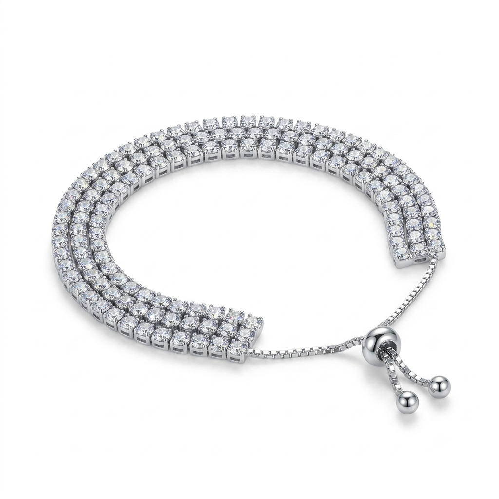 A silver-toned triple-row diamond bracelet with a beaded extender chain and ball clasp, displayed on a clean white background.