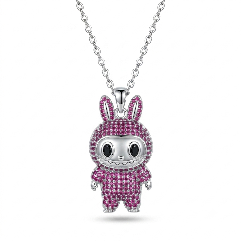 A silver bunny pendant necklace on a delicate silver chain, featuring a silver bunny body encrusted with sparkling pink gemstones, set against a clean white background.