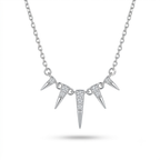 A silver-toned spike necklace featuring three pointed spikes on a delicate link chain, with the center spike adorned with small clear stones, shown against a plain white background.