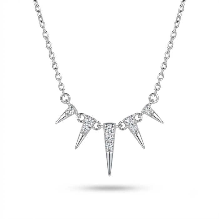 A silver-toned spike necklace featuring three pointed spikes on a delicate link chain, with the center spike adorned with small clear stones, shown against a plain white background.