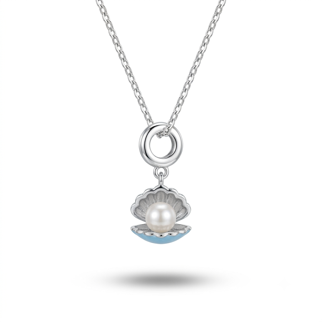 A silver chain necklace featuring a pendant shaped like an open clam shell. The pendant has a silver-toned metal frame, a white pearl in the center, and light blue enamel detailing along the bottom edge, set against a plain white background with a soft shadow below.