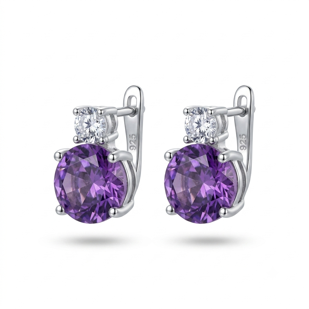 A pair of sterling silver drop earrings featuring a large round purple amethyst gemstone and a smaller clear round-cut gemstone, shown on a white background with soft drop shadows.