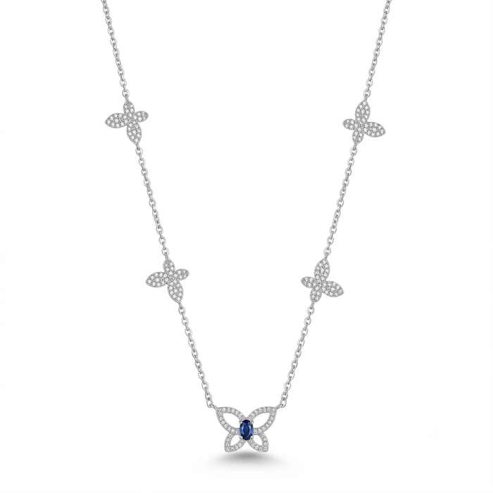 A silver-toned necklace featuring five diamond-paved butterfly motifs along the chain, with a larger butterfly pendant at the center set with a round blue gemstone, shown on a plain white background.