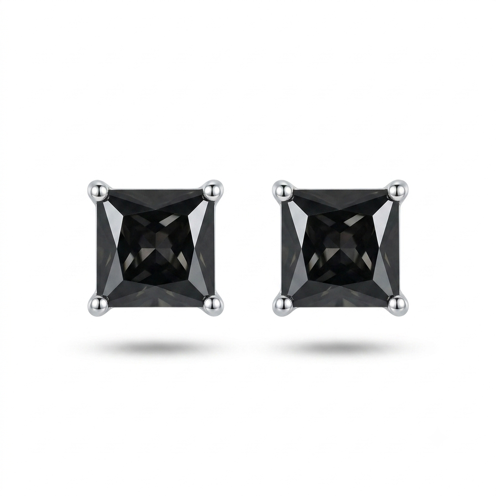 A pair of princess-cut black gemstone stud earrings in silver four-prong settings, shown on a clean white background with soft drop shadows.