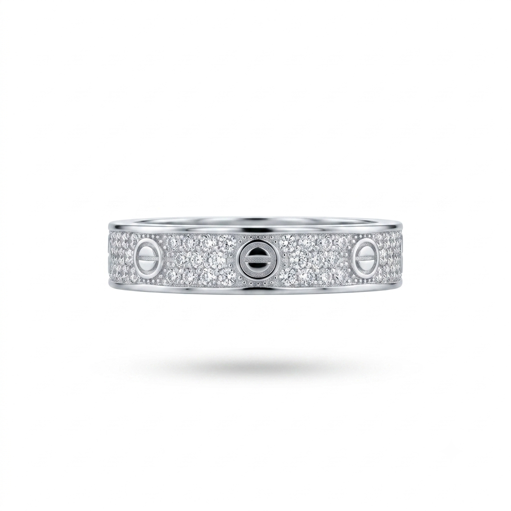 A silver-toned ring featuring three screw-head motifs surrounded by pavé-set clear stones, shown against a plain white background with a soft shadow underneath.