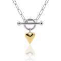 A silver chain necklace with a toggle clasp and a dangling polished gold heart charm, shown on a clean white background with a soft reflection below.