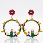 Colorful earrings with characters and flowers on a white background
