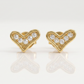 Gold heart-shaped earrings with embedded diamonds