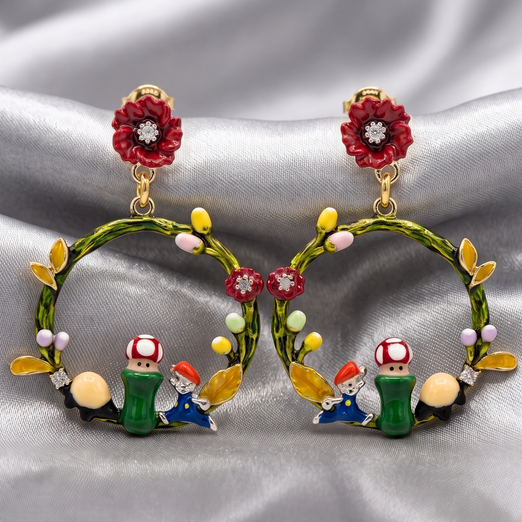 Pair of earrings with cartoon character design on a silver fabric background