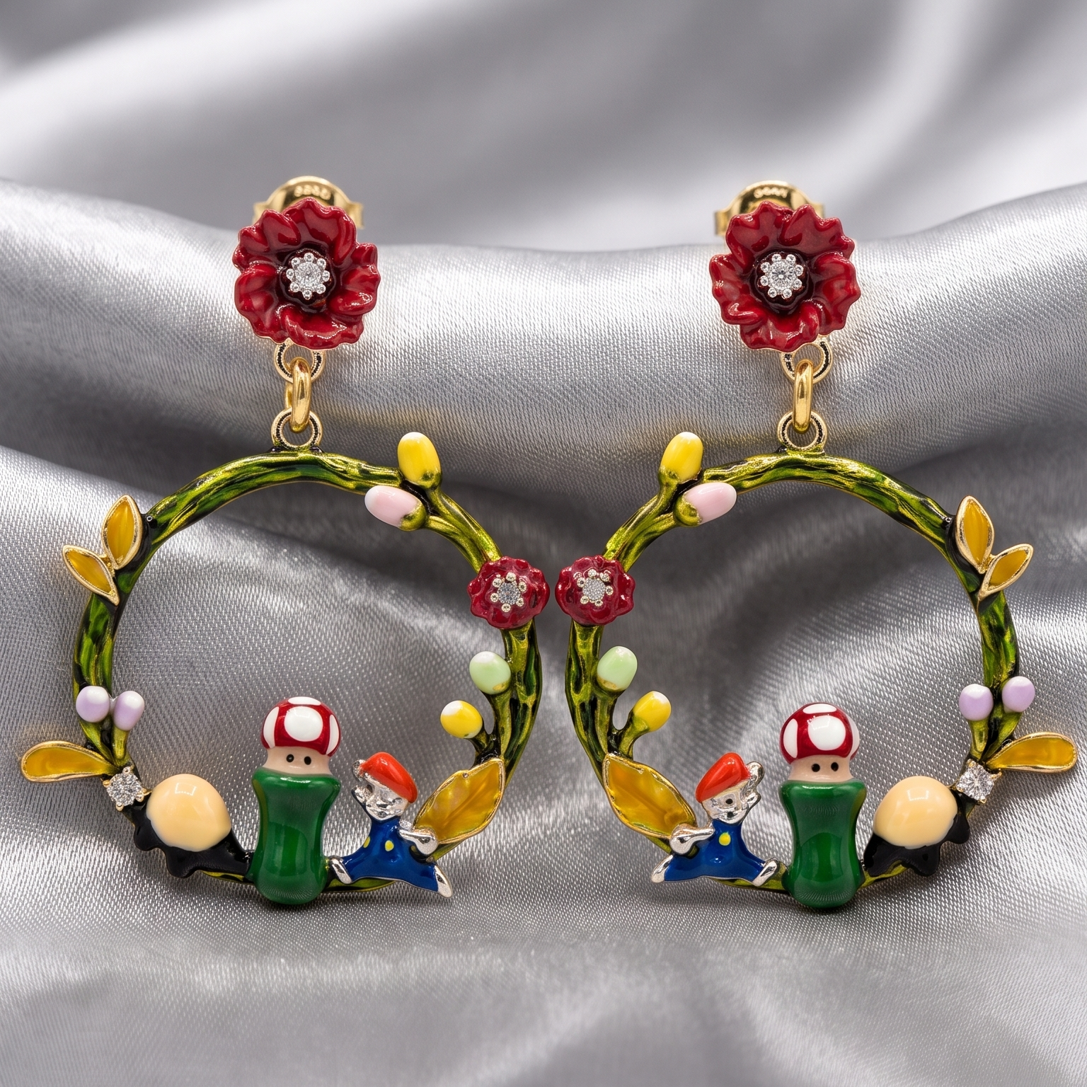Pair of earrings with cartoon character design on a silver fabric background