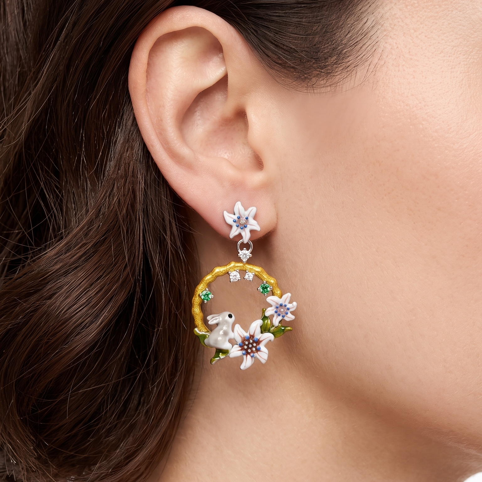 Close-up of a person wearing floral hoop earrings with a blurred background