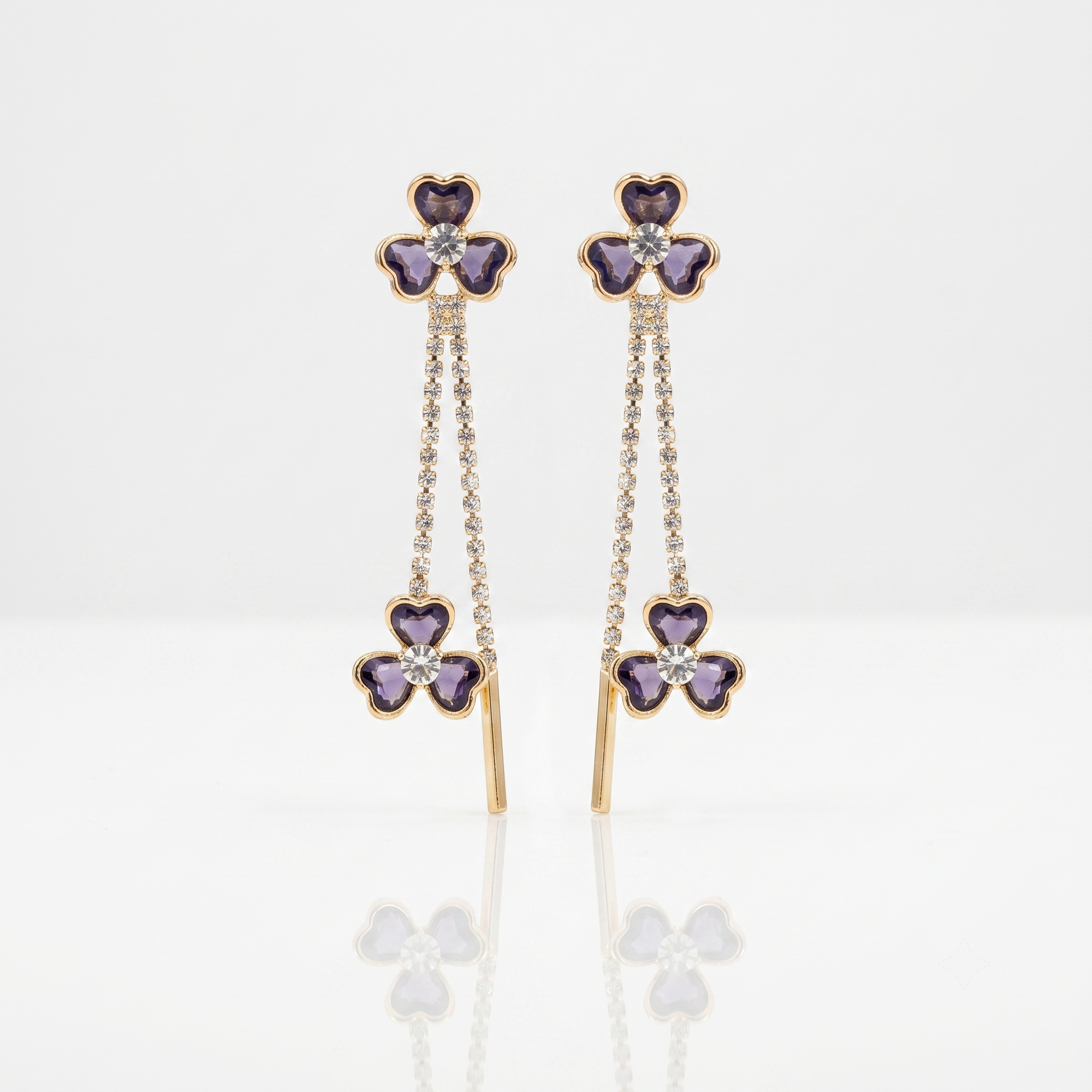 earrings with purple clover-shaped stones with diamonds and gold drop