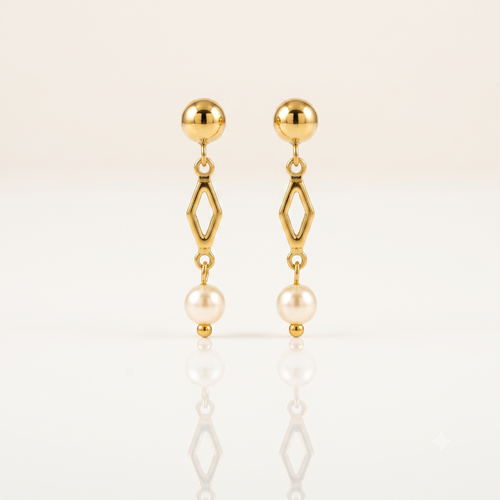 A pair of gold dangle earrings with a spherical stud, an open diamond-shaped link, and a hanging pearl, displayed on a clean white reflective surface.
