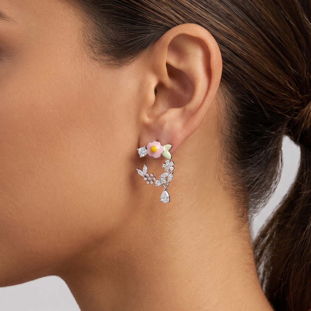 Close-up of an ear wearing a floral earring with a blurred background