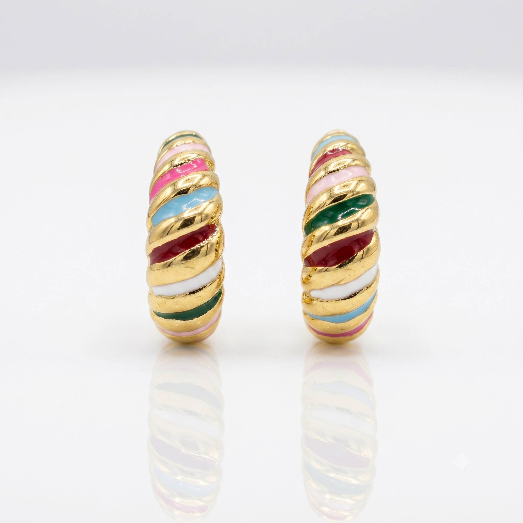 Pair of gold hoop earrings with colorful stripes