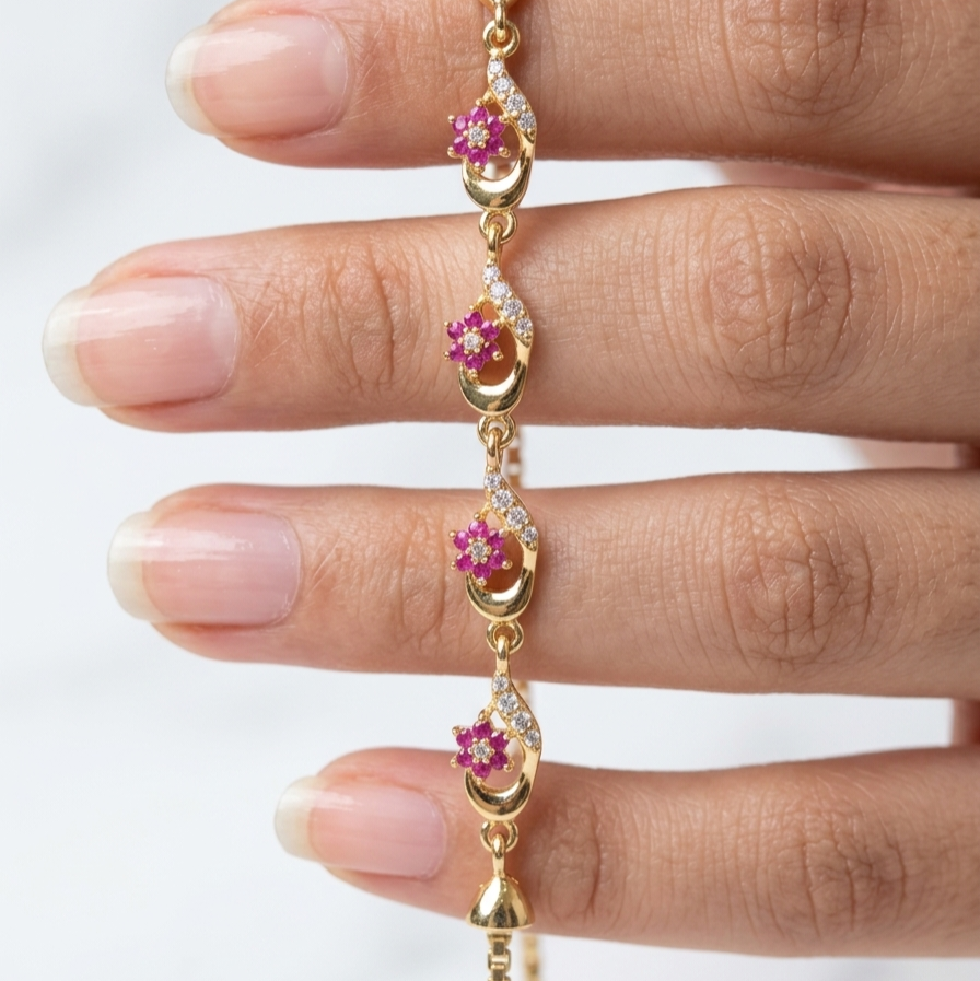 Gold bracelet  with flowers and gemstones and crystals