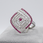 Silver ring with red gemstones and diamonds