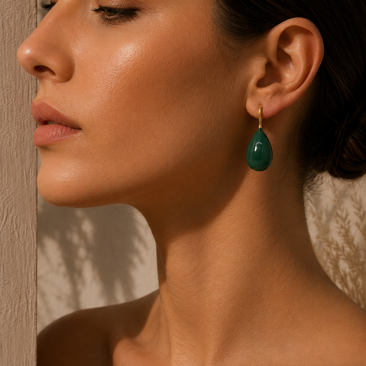 Green teardrop earrings with gold hooks