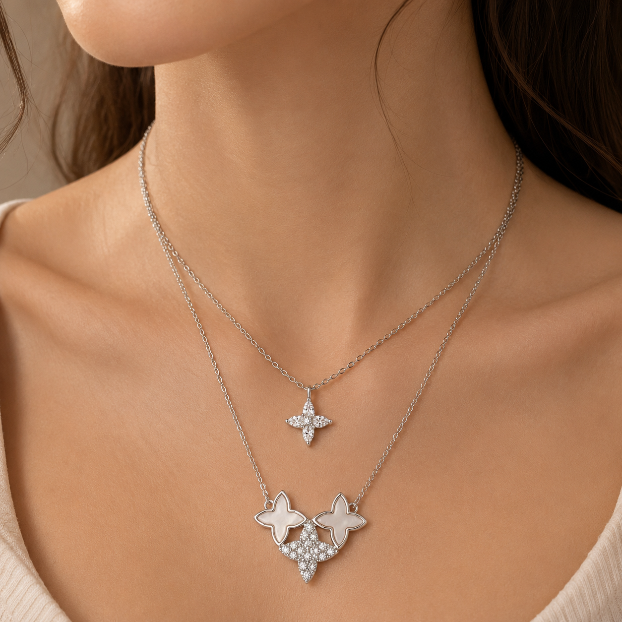 Silver star-shaped necklace on a person's neck