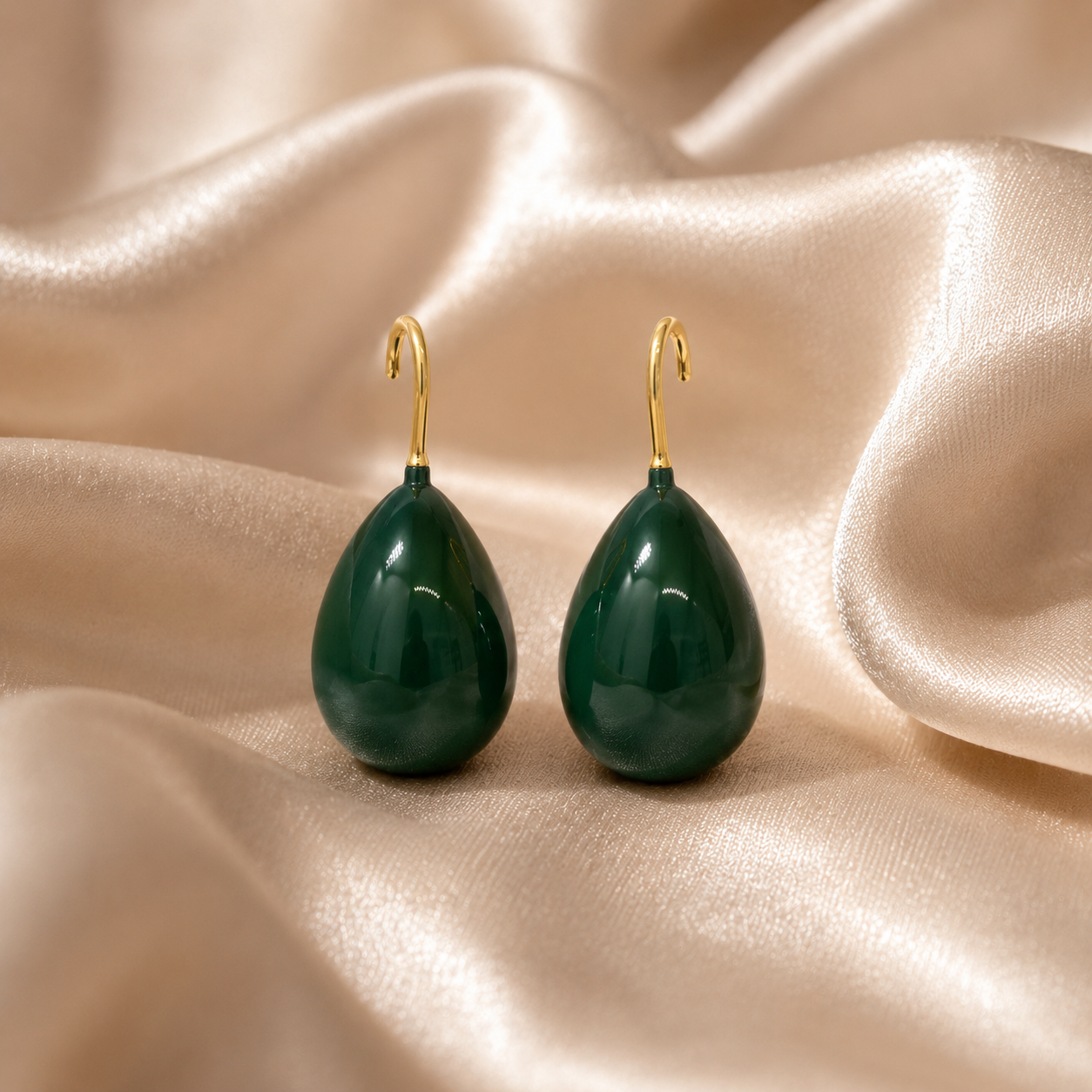 Green teardrop earrings with gold hooks