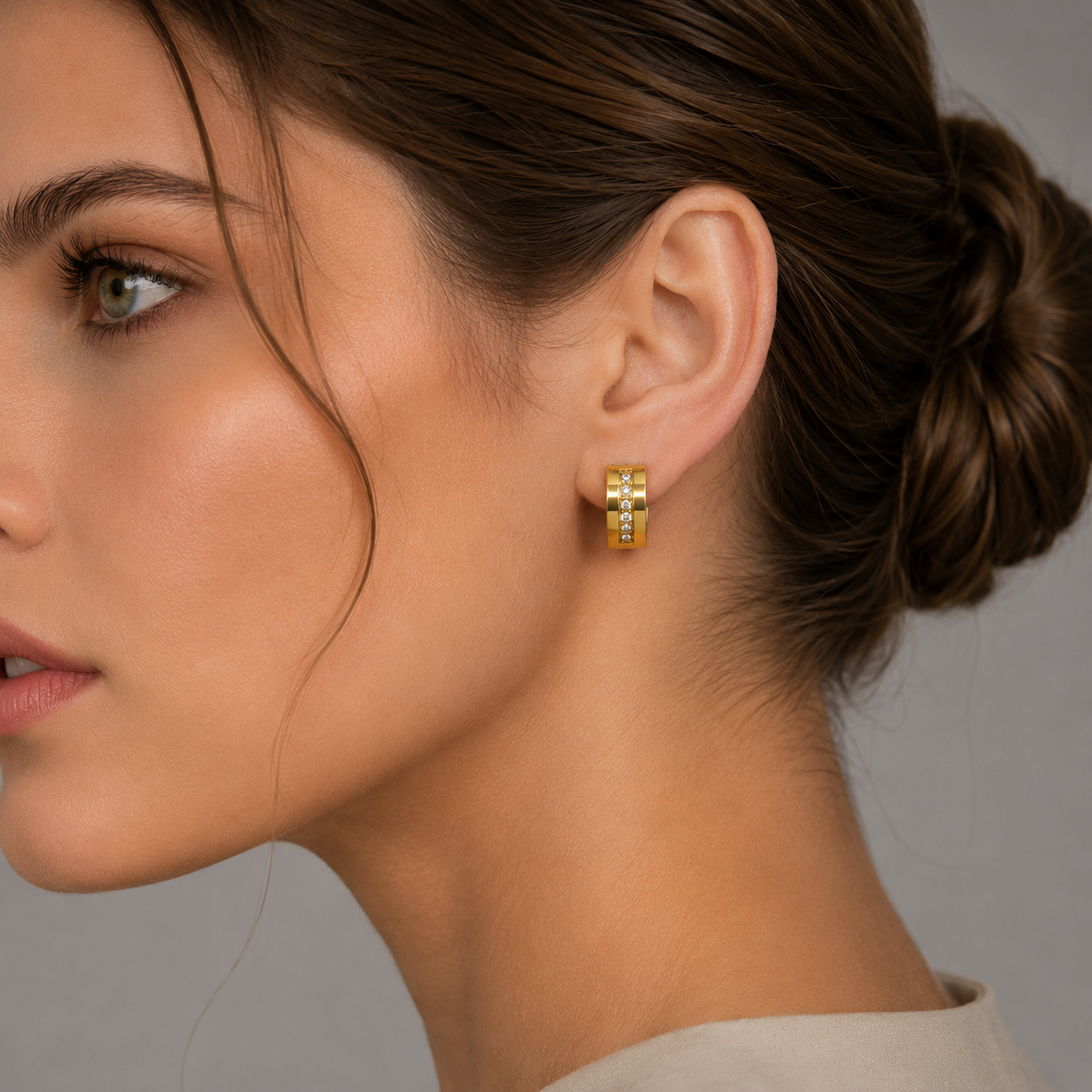 woman wearing gold hoop earrings with diamonds