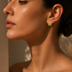 Close-up of a woman wearing a gold star-shaped earring