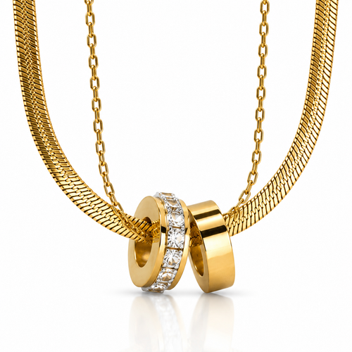 Gold necklace with two interlocking rings on a white background
