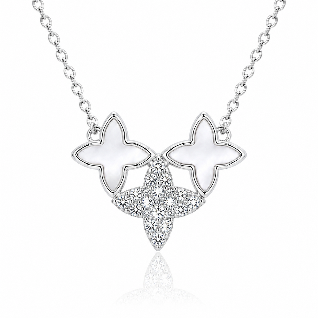 Butterfly-shaped necklace with white stones on a white background