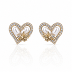 Heart-shaped earrings with pearls and gold accents and diamonds