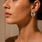 Close-up of a woman wearing a pearl and diamond earring