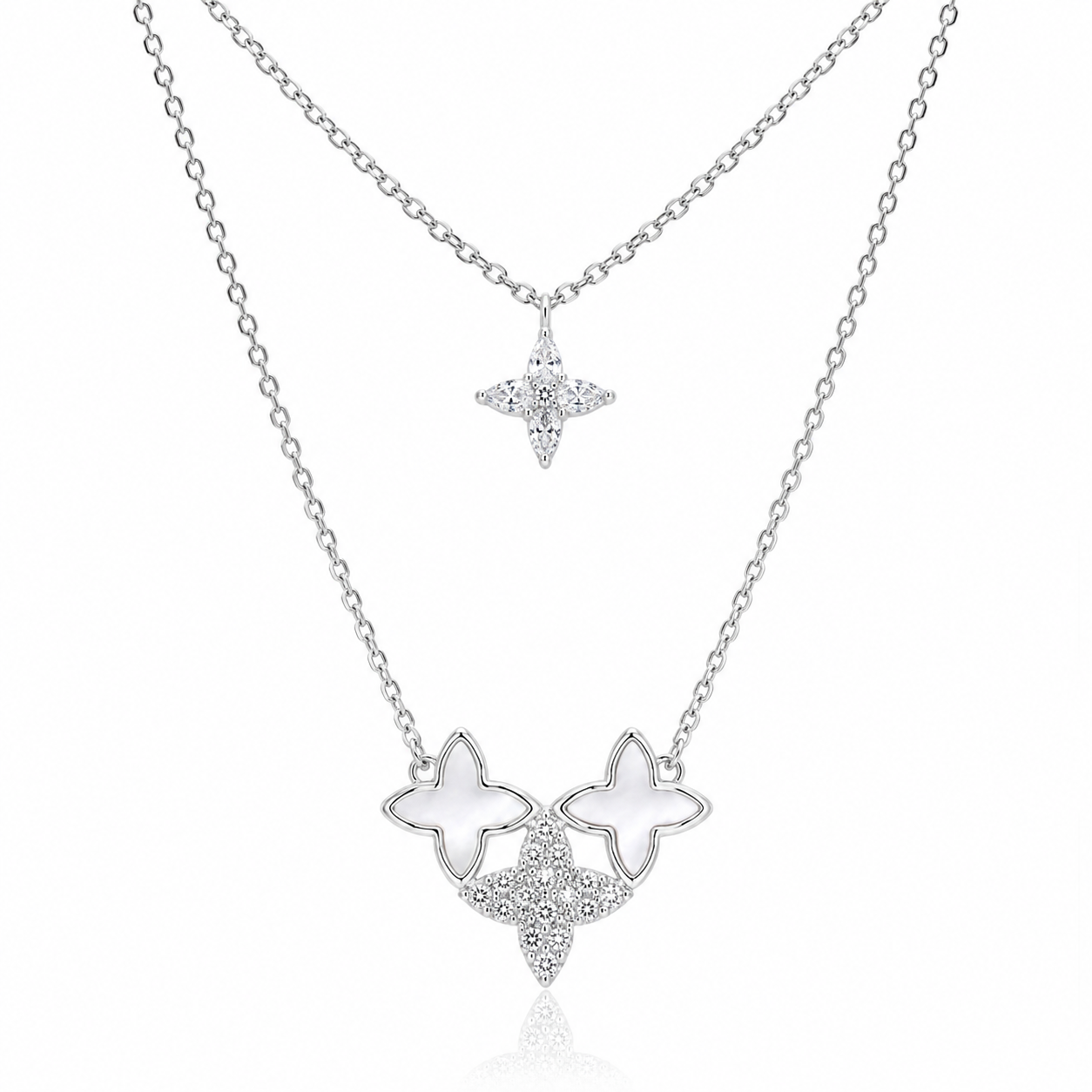 Star-shaped silver necklace with white stones on a white background