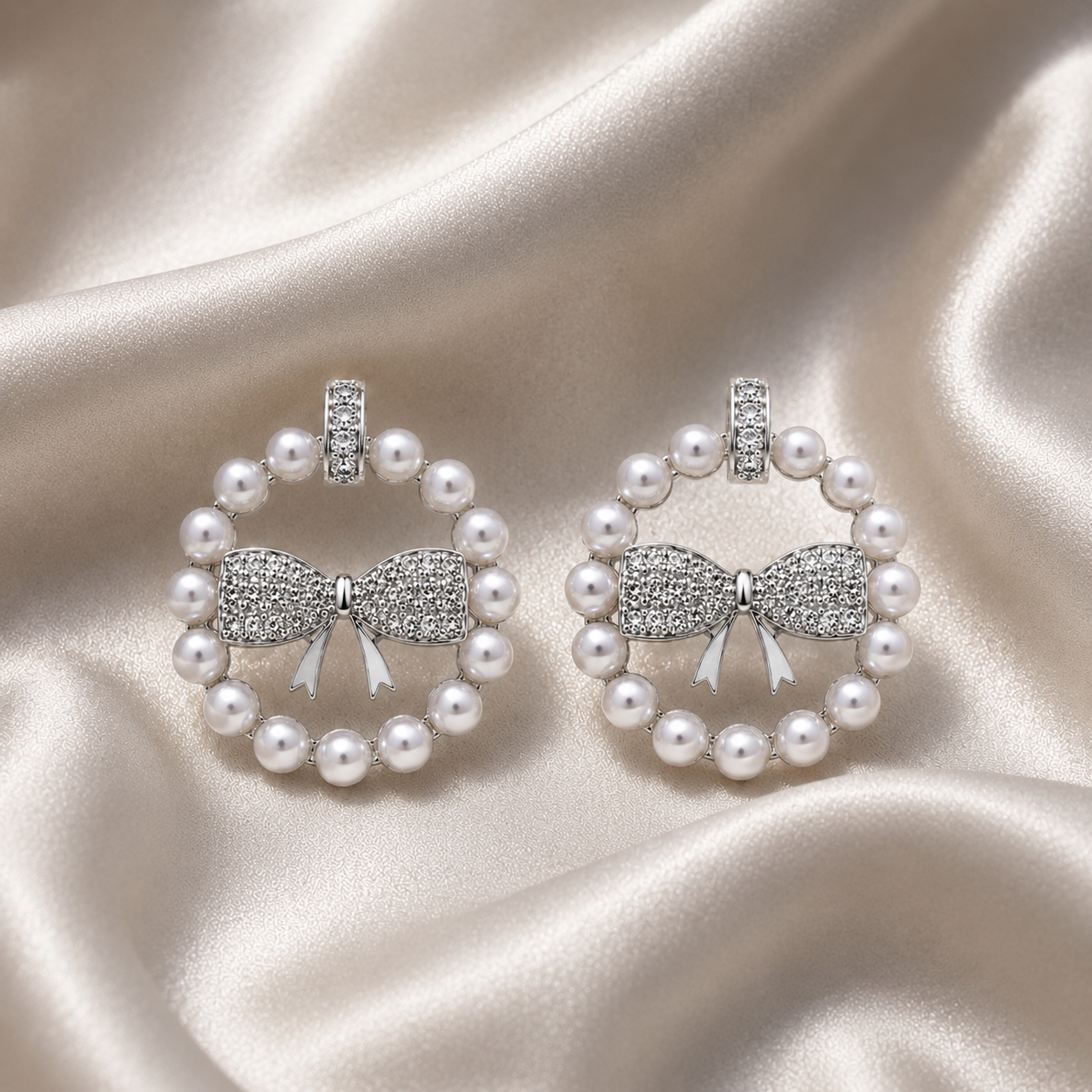 Pearl earrings with bow design
