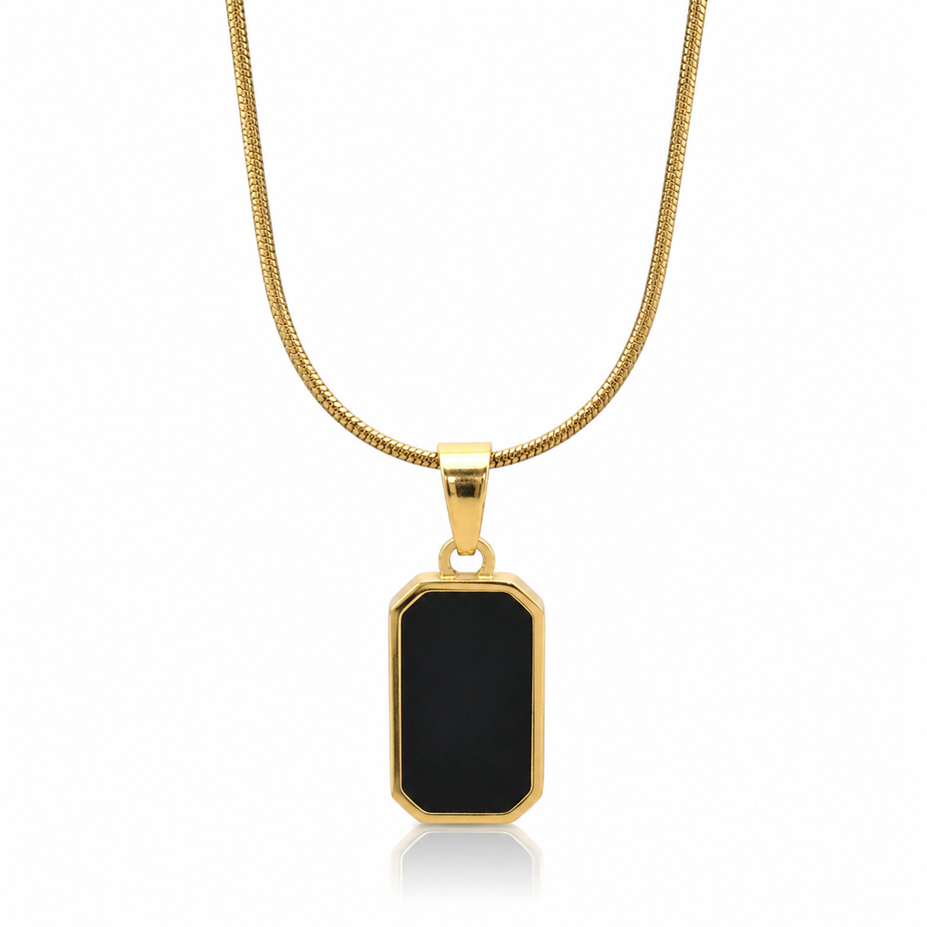 Gold necklace with a black pendant