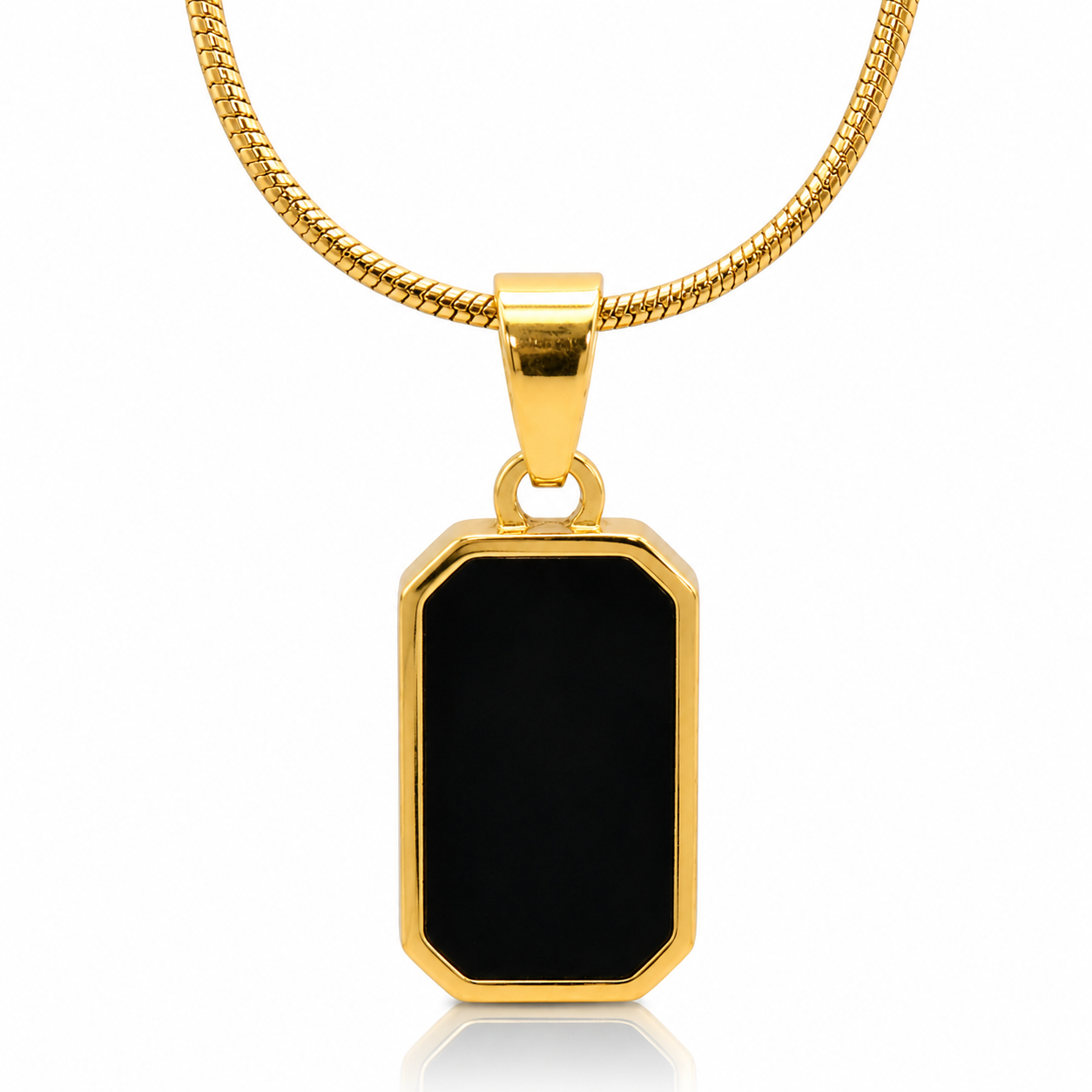 Gold pendant with a black stone