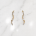 Gold earrings with a wavy design