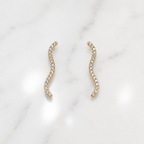 Gold earrings with a wavy design