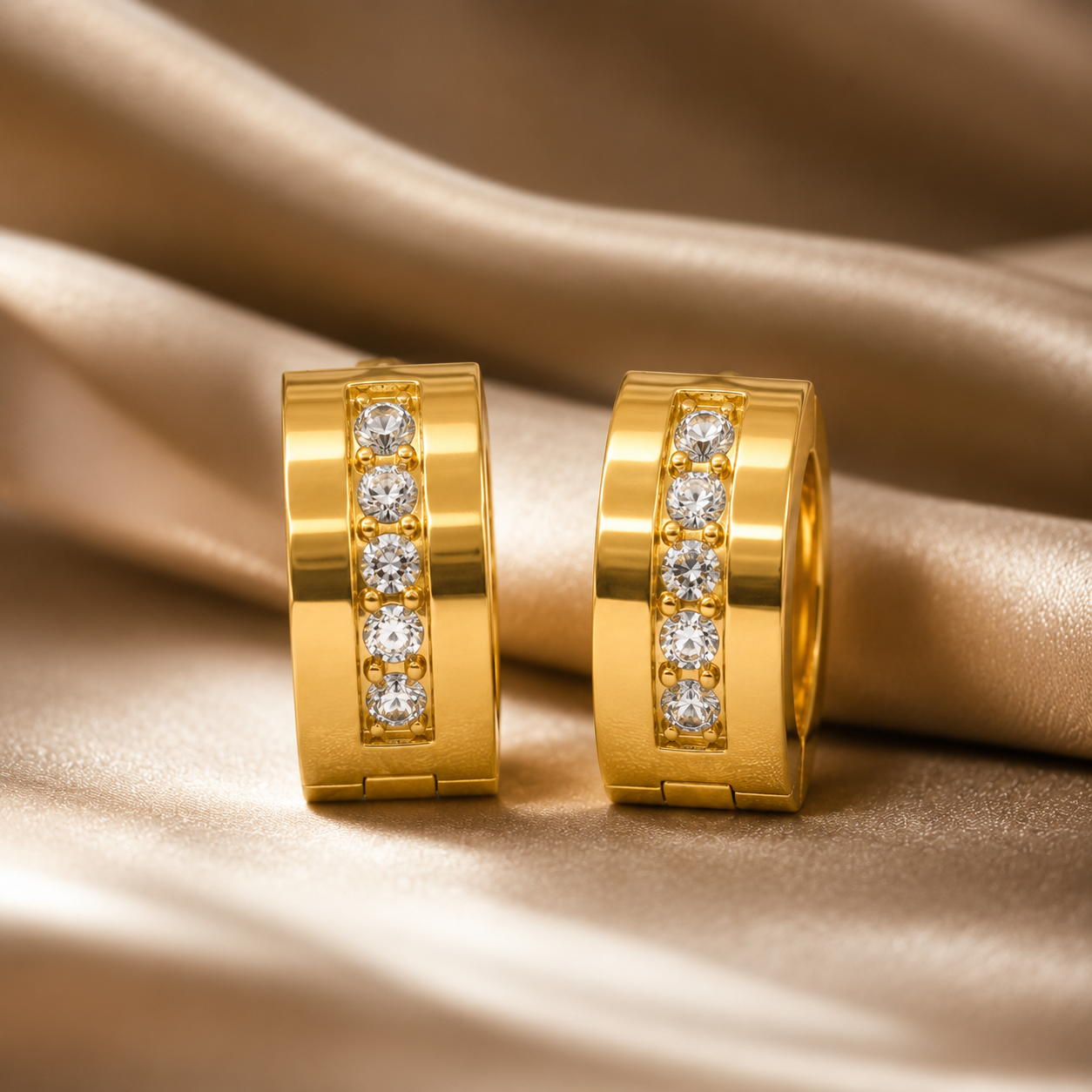Gold hoop earrings with embedded diamonds