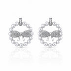 Pearl earrings with bow design