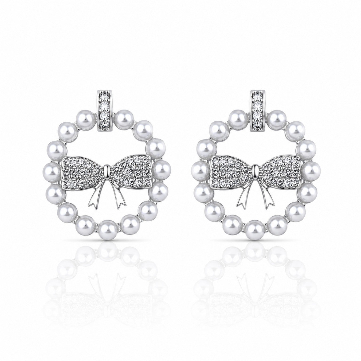 Pearl earrings with bow design