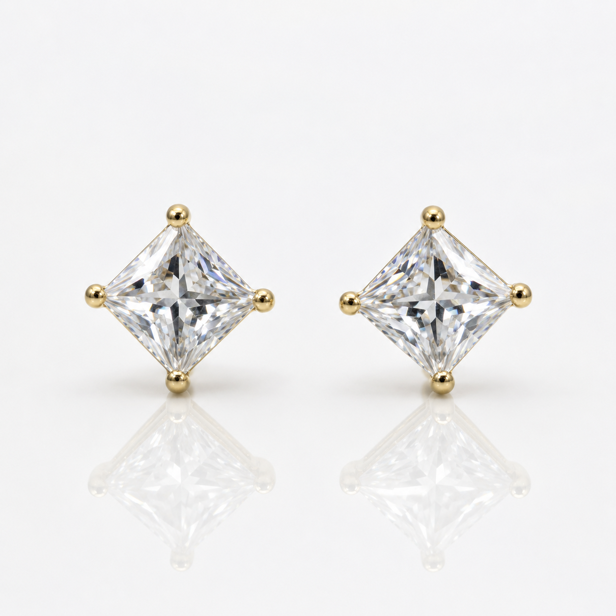 diamond stud earrings with gold prongs