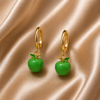Gold hoop earrings with green apple charms